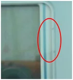 Dust inside the enclosure. The source identifies internal dust in the marked area.
