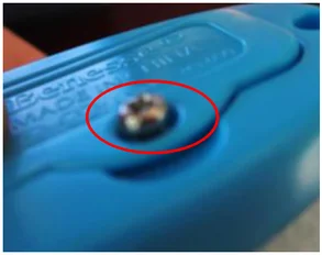 Screw not fully seated. The ellipse highlights the screw projecting above its seating position.
