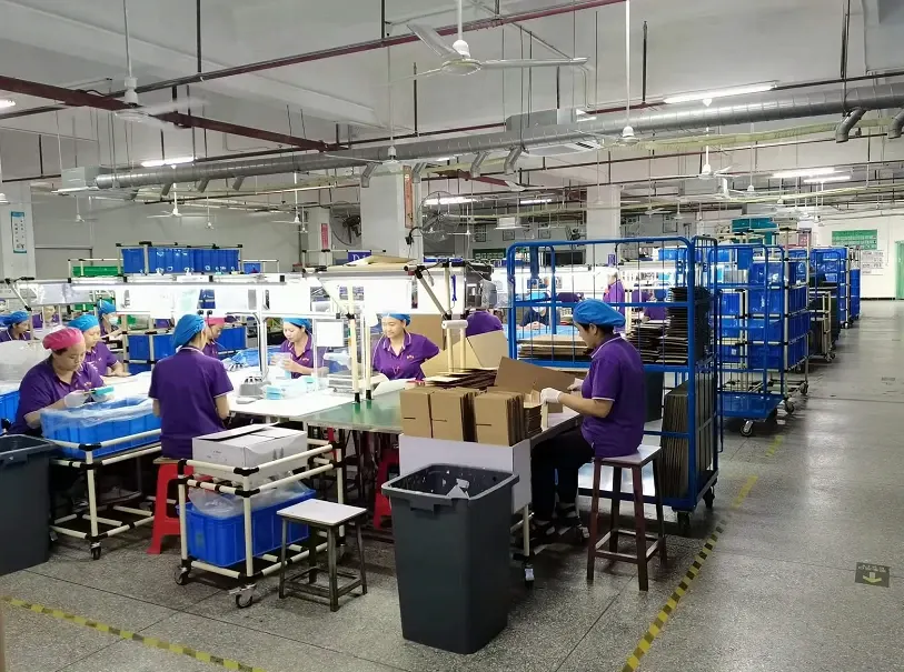 Operators, work tables and cartons in the packaging area