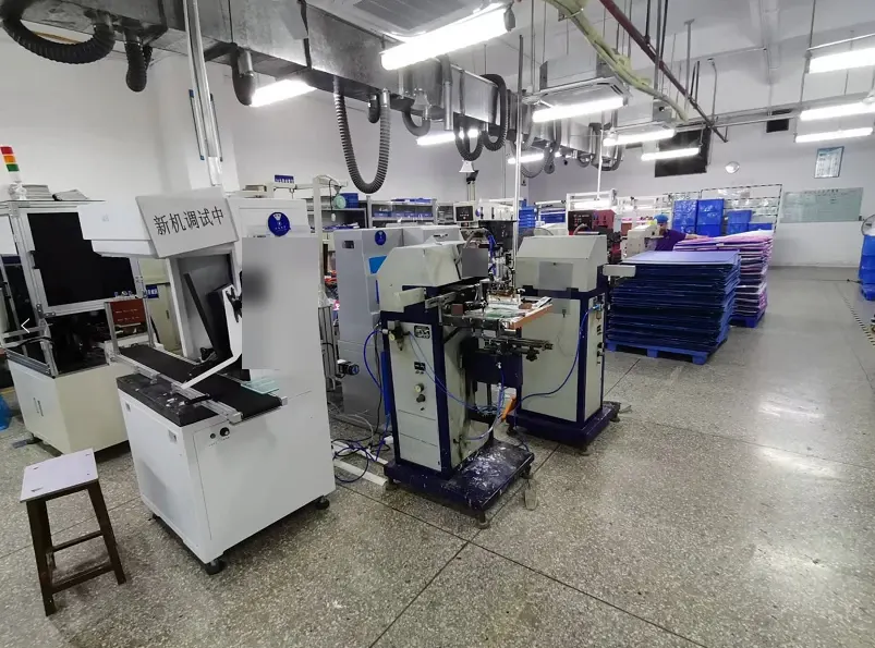 Equipment and material trays along the printing and ultrasonic workshop aisle