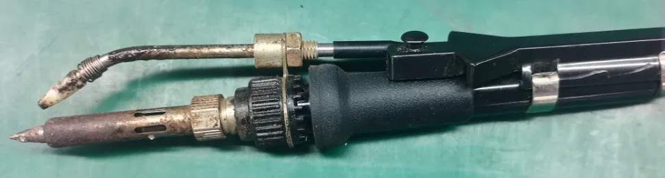 Manual solder-feeding irons and tips pictured in the assembly training material