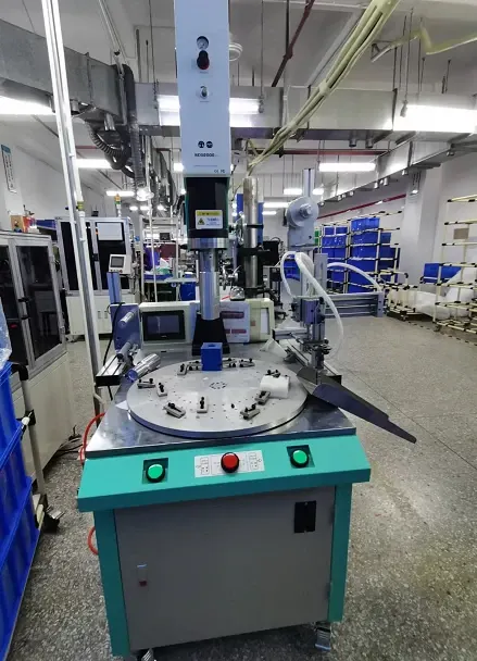 Ultrasonic welding machine with a rotary work fixture