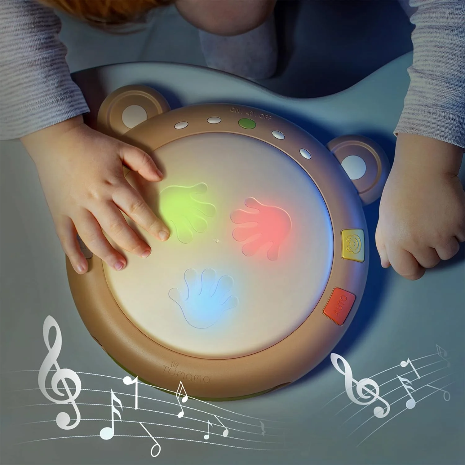 Baby playing the drum with illuminated palm-shaped pads