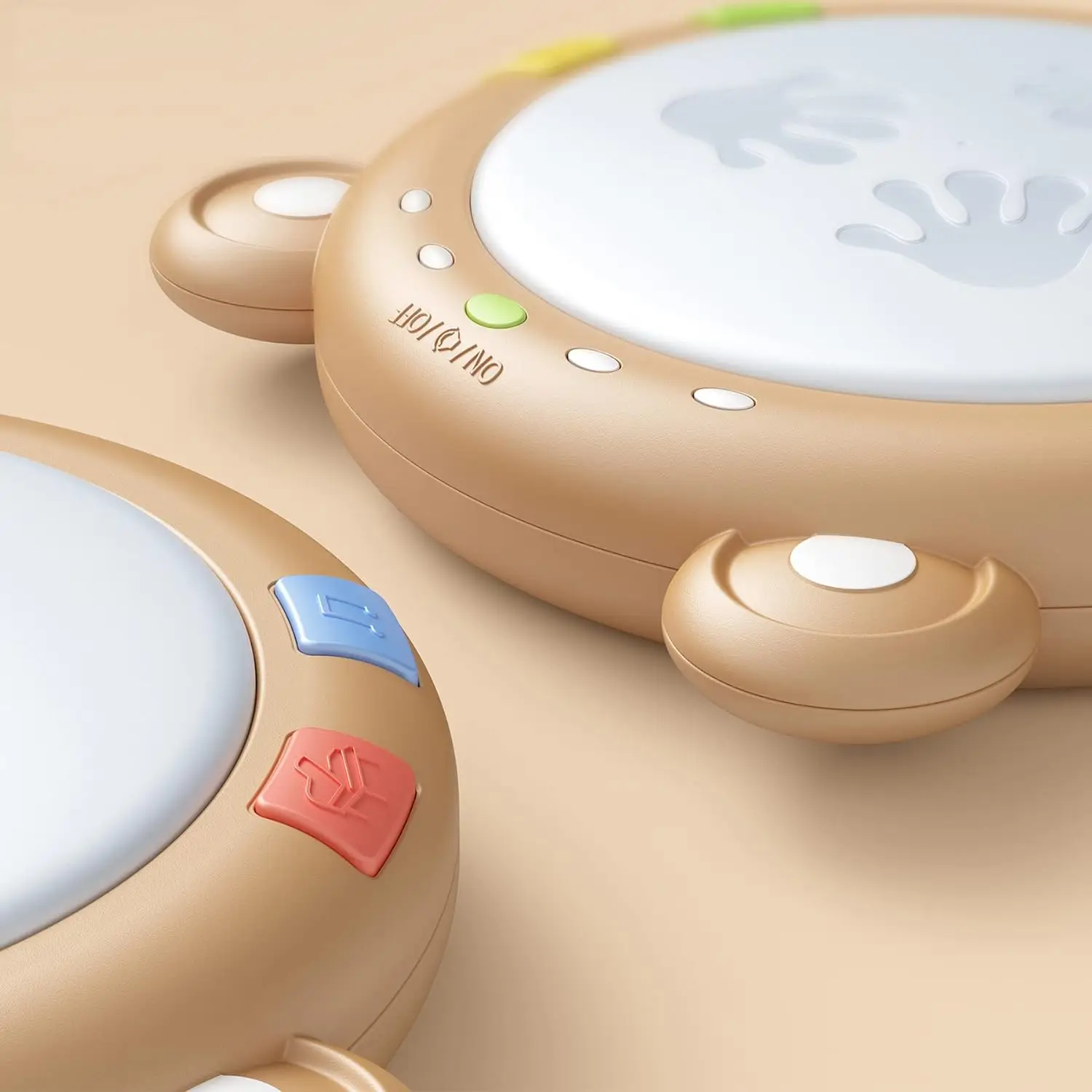 Close-up of the drum’s rounded edges, power switch, and music buttons