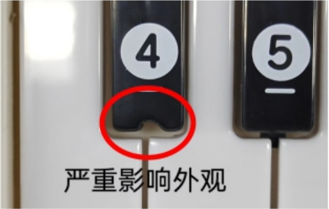 A red oval marks a missing notch of material at the lower edge of a black key marked 4.