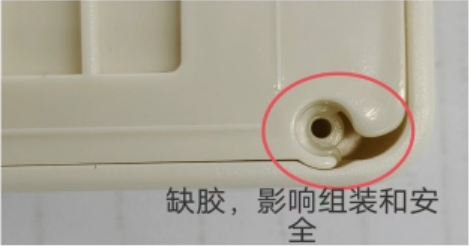 A pink oval marks missing plastic beside a white mounting hole in the source example affecting assembly and safety.