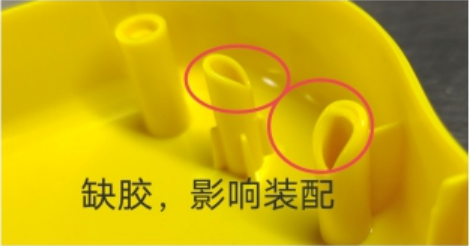 Pink circles mark incomplete yellow molded posts in the source example of a short shot affecting assembly.